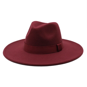 Detailed view of burgundy wool felt wide-brim fedora hat with a matching ribbon bow