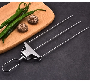 Three-prong stainless steel BBQ skewer with a sliding slider for easy food removal