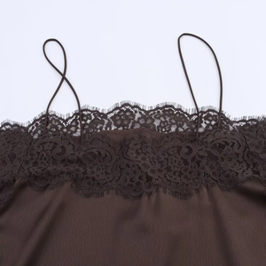 Close-up of dark brown satin camisole with delicate lace trim on the neckline