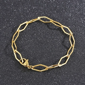 Detailed view of a gold geometric hexagonal chain necklace with a lobster clasp closure