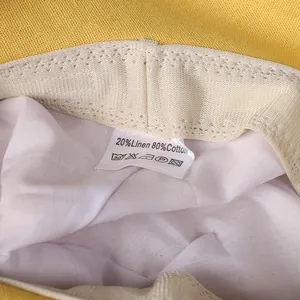 Detailed macro shot of the linen and cotton blend fabric label on the sun hat