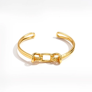 Minimalist 18K gold plated knot bangle featuring an oval open cuff design for women
