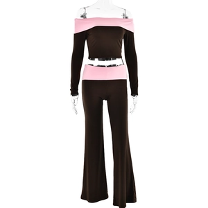 Detail of off-shoulder long sleeve top and flared pants with pink color block trim