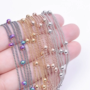 Detailed macro view of 1.5mm stainless steel ball chains in four metallic color finishes