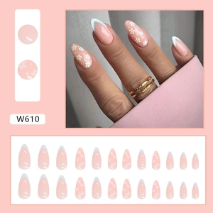 Light blue floral French tip press-on nails with daisy patterns in long almond shape