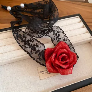 Elegant black lace choker with a glitter red rose pendant and white pearl accents