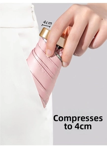 Pink ultra-thin 4cm portable folding umbrella easily fits into a pocket for travel
