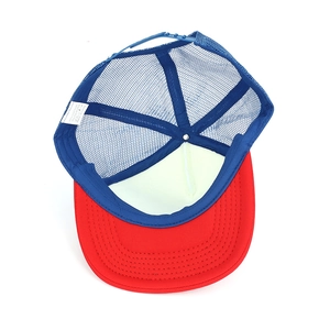 Internal label showing 65% cotton and 35% polyester mix of red and blue trucker hat