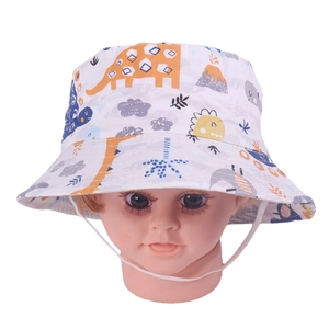 Detail of dinosaur print kids sun hat with adjustable white windproof chin strap