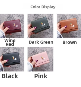 Detail view of tri-fold wallets in wine red, dark green, brown, black, and pink colors