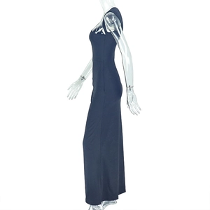 Detailed side view of black bodycon dress featuring elegant draping and sleek fabric