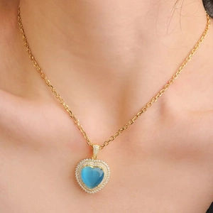 Blue heart topaz necklace with moissanite accents on elegant gold chain for women
