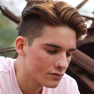 Close-up of a man wearing a double-layered black stainless steel spiral nose ring piercing