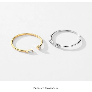 Detailed shot of adjustable S925 silver rings with micro-set zircon in gold and silver