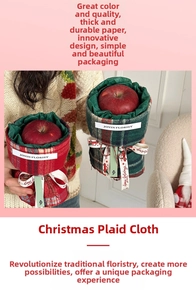 Close-up of Christmas red and green plaid fabric wrap with festive ribbon and label