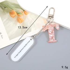 Pink marble letter T keychain with 13.5cm length and 9.5g weight detail specifications
