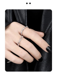 Detailed close-up of S925 sterling silver chain and infinity design open rings for couples