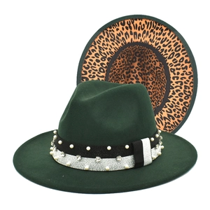 Detail of dark green wool fedora with leopard print lining and pearl rhinestone band