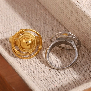 Modern two-tone stainless steel celestial rings with 18K gold plating and layered orbit design