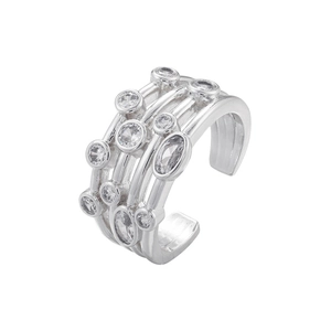 Macro view of multi-layer open ring featuring polished silver bands and sparkling zircon stones