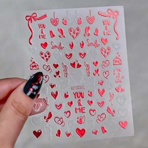 Close-up of red metallic heart nail stickers with love motifs and XZ-D2312 model details
