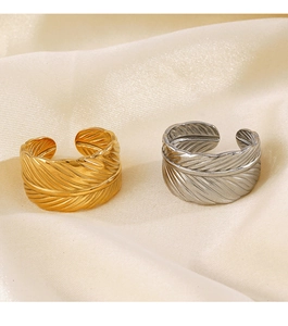 Detailed view of adjustable stainless steel feather rings in gold and silver finishes