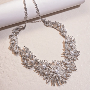 Silver floral branch statement necklace with imitation pearls and metallic texture