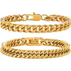 Detail showing gold Cuban link bracelets with lobster claw and folding clasps