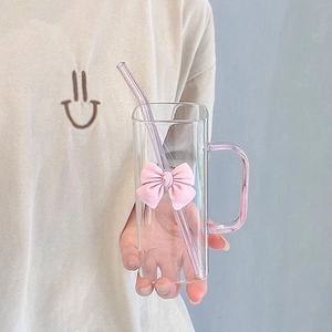 Minimalist square glass cup with pink handle, bow decoration and glass straw