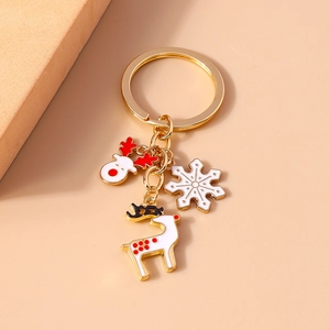 Christmas reindeer keychain with gold metal ring, white snowflake and enamel deer charms