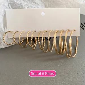 6-Pair Set of golden hoop earrings featuring twisted, smooth, and wavy metal designs