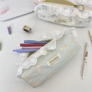 Detailed view of cat print pencil cases with lace trim and large zipper ring pullers