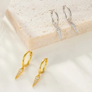 Close-up of S925 sterling silver cone drop earrings in gold and silver with zircon