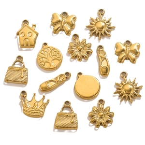Golden stainless steel pendants featuring crown, tree of life, and house charms on white background
