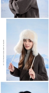 Detail of warm winter trapper hat with thick faux rabbit fur and cozy ear flaps