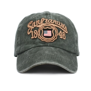Close-up of vintage washed green cotton baseball cap with American flag and 1846 embroidery