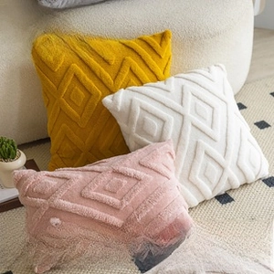 Detailed view of tufted diamond patterns on soft polyester pumpkin throw pillow covers