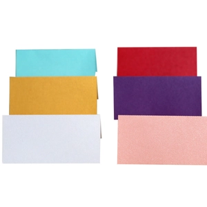 Colorful rectangular wedding place cards in multiple shades on white background