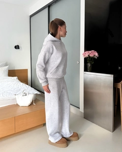 Detail of grey hooded tracksuit set with soft texture and wide-leg joggers for women