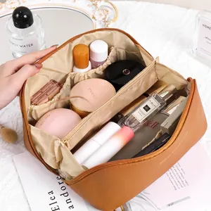 Brown PU leather travel makeup bag with large capacity and multi-compartment interior