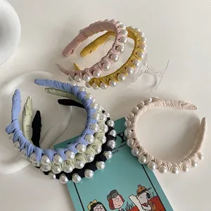 Elegant twisted fabric headband with pearls in six colors for women and bridal wear