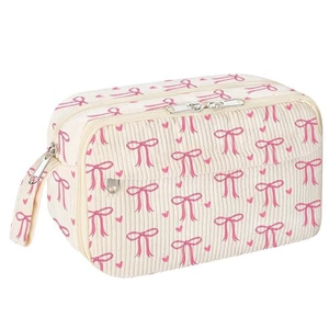 Detail of corduroy pencil case featuring pink bow pattern and durable metal zipper