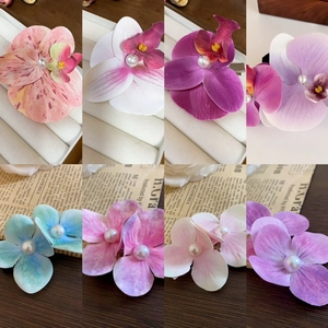 Elegant silk orchid hair claws with center pearls in eight assorted gradient colors