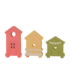 Detailed close-up of three colorful silicone mini house molds for DIY crafts and resin art