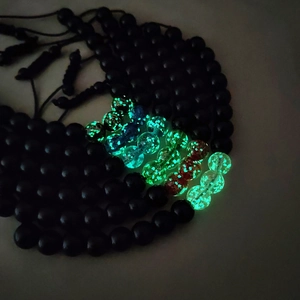 Luminous beaded bracelets with adjustable braided rope showing glowing colorful beads
