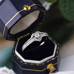 Close-up of heart-shaped diamond ring in a luxury velvet hexagonal jewelry box