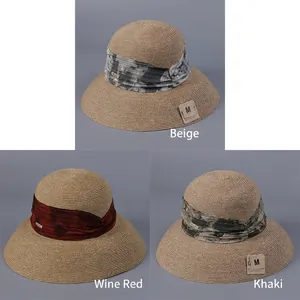Elegant women's bell-shaped straw sun hats in beige, wine red, and khaki colors