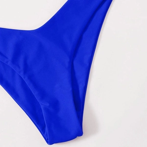 Solid royal blue triangle bikini bottom with high-cut design and matte finish fabric
