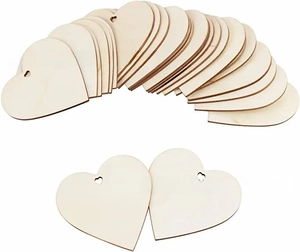 Close-up of heart shaped wooden tags with pre-drilled holes for DIY craft projects