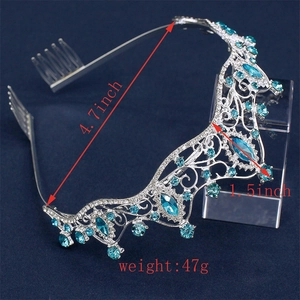 Silver bridal crown detail with blue gems, clear rhinestones and dimensions 4.7x1.5 inches